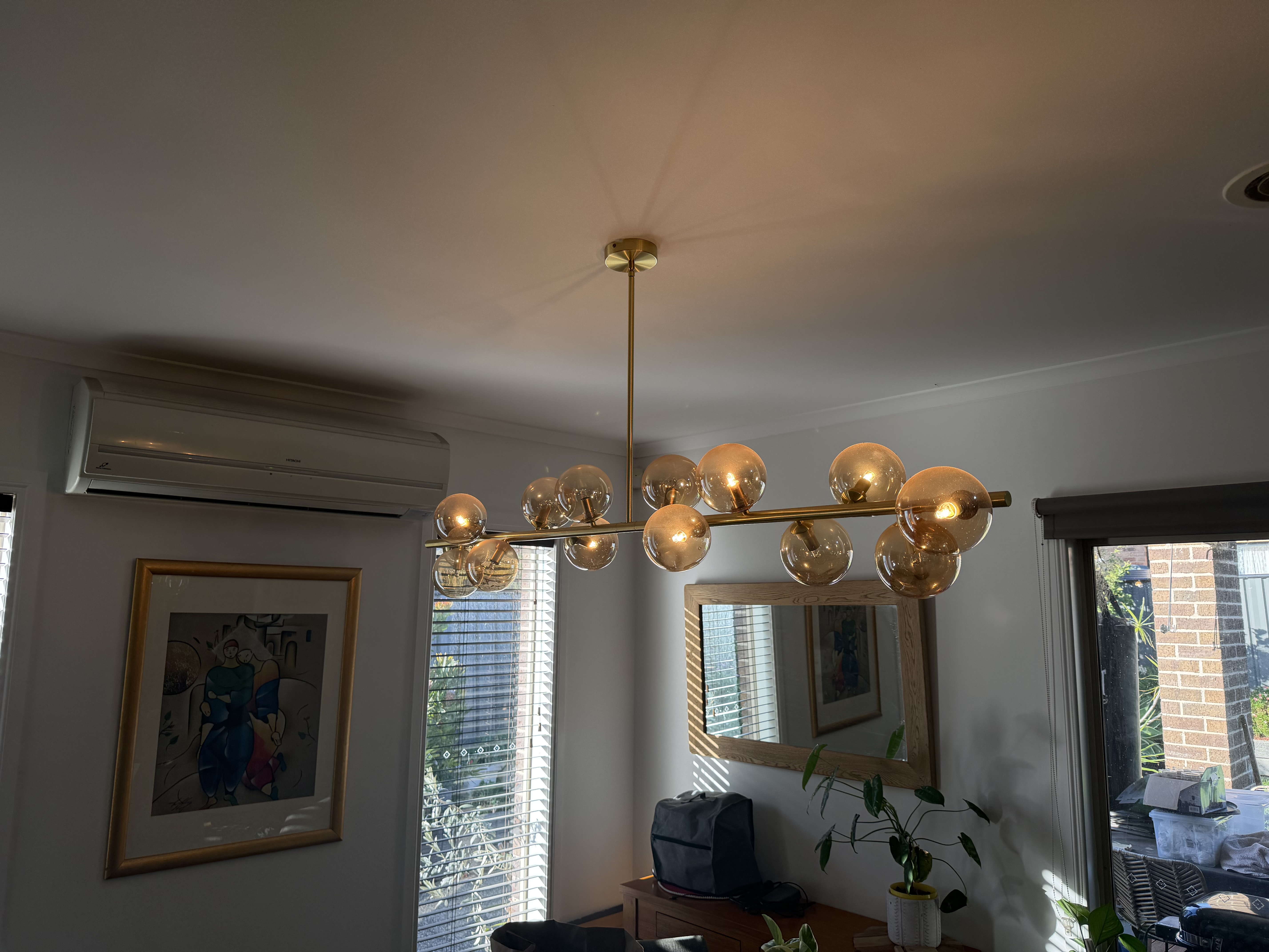 Brass globe pendant chandelier installed by Spiteri Electrical